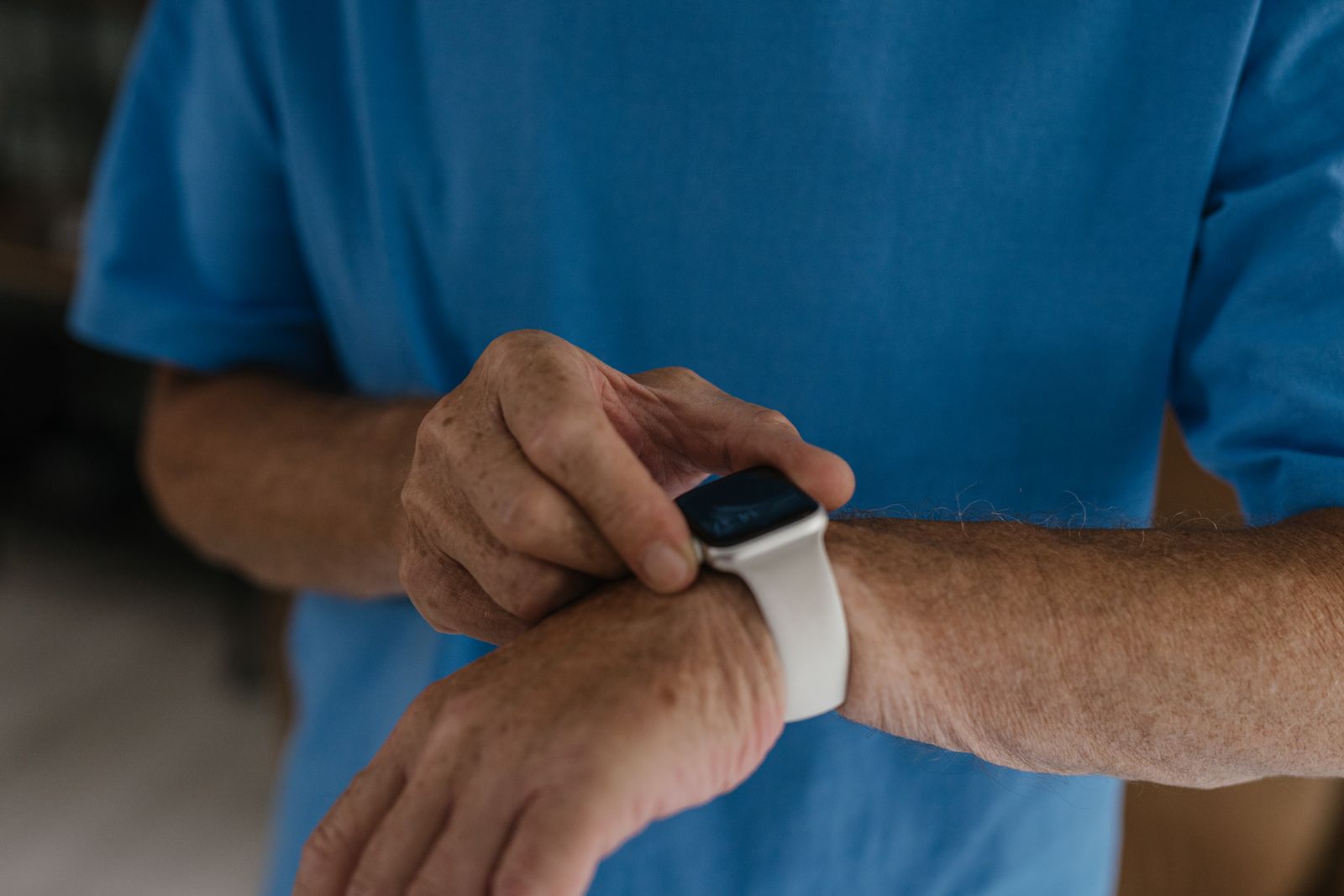 A smartwatch worn on the wrist showing on-device health and activity metrics